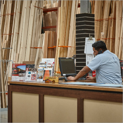 Ganahl employe helping a customer over the phone.