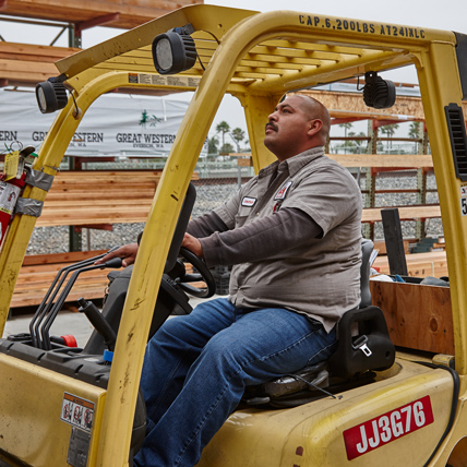Ganahl Lumberyard employee operating a forklift. 