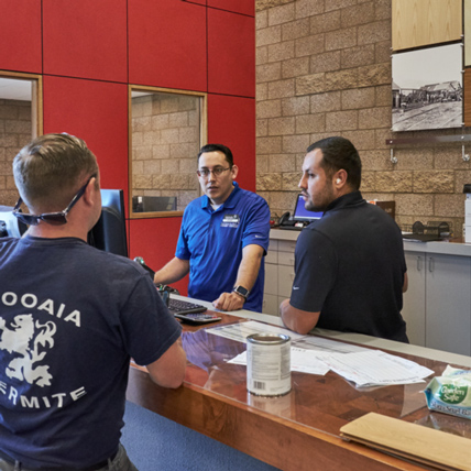 Ganahl Lumber employees helping a customer.