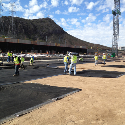 Building site full of busy construction workers. 
